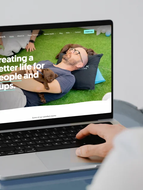 The landing page of the Paws in Work website built with Craft CMS viewed on desktop