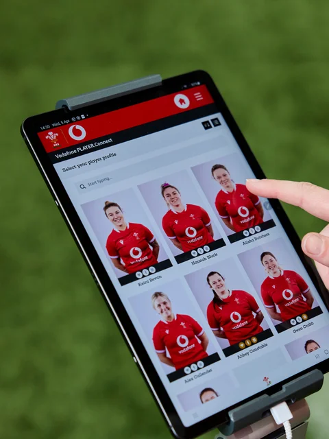 PLAYER.Connect's page of player profiles on tablet held by team coach