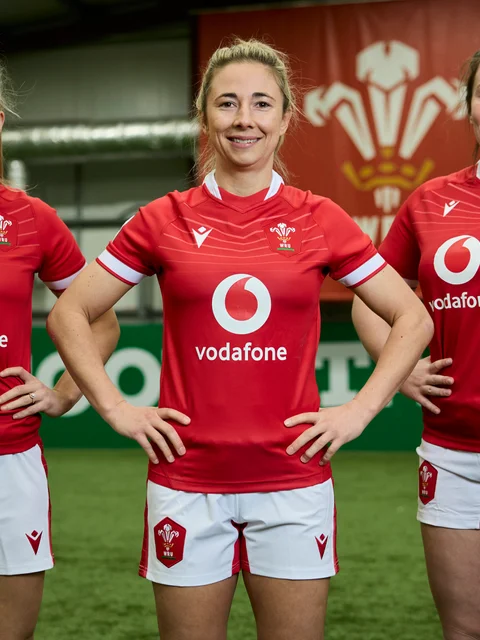 3 WRU players are standing and smiling